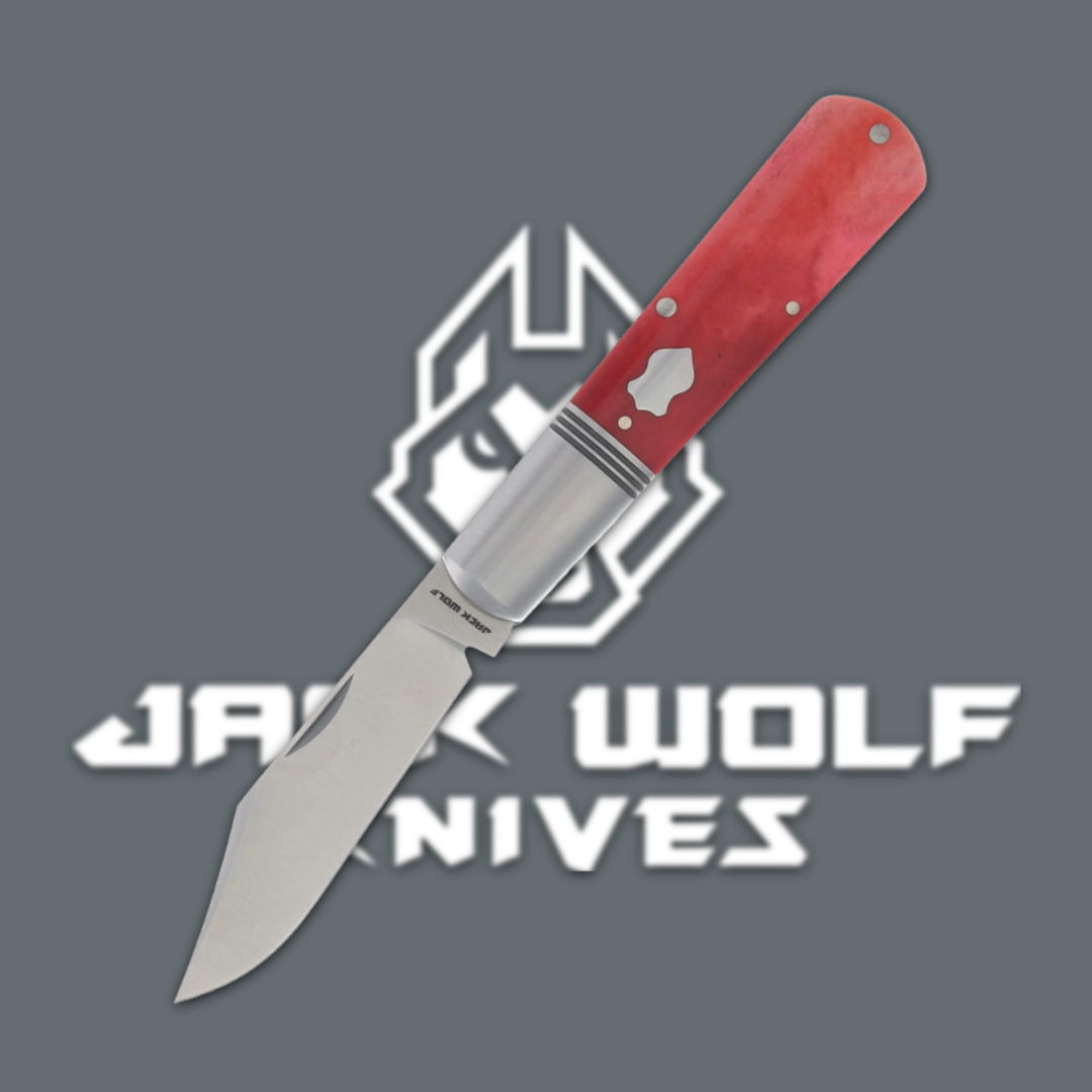 A red folding knife with a silver blade and Jack Wolf Knives logo.