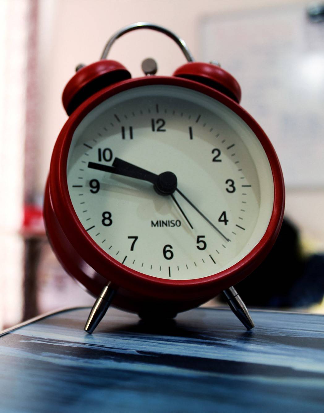 a red analog alarm clock