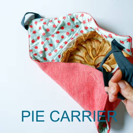 A bag to carry a pie holding an apple pie
