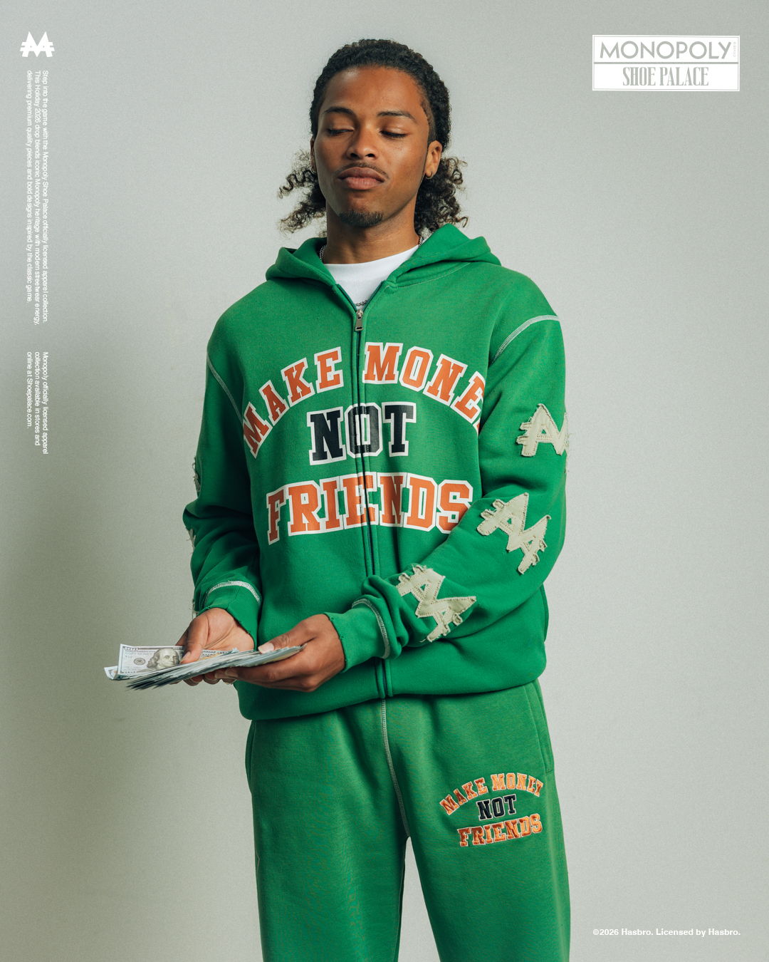 Person in green hoodie and sweatpants holding a clipboard.