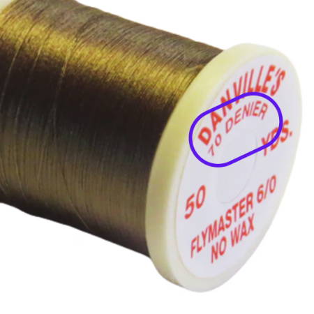 Spool of thread with denier measurement on it