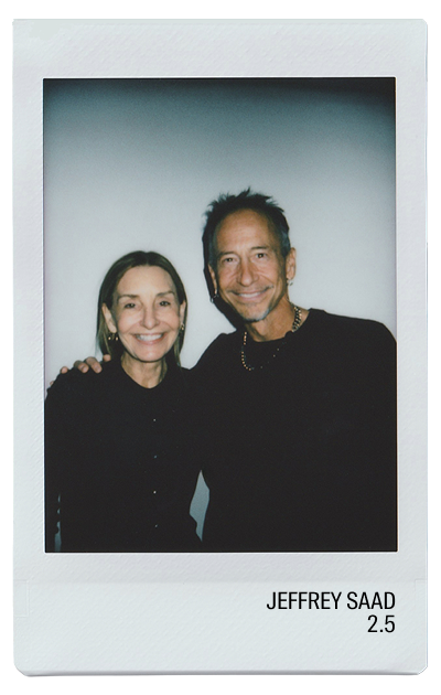 Two smiling individuals posing together in a polaroid photograph.