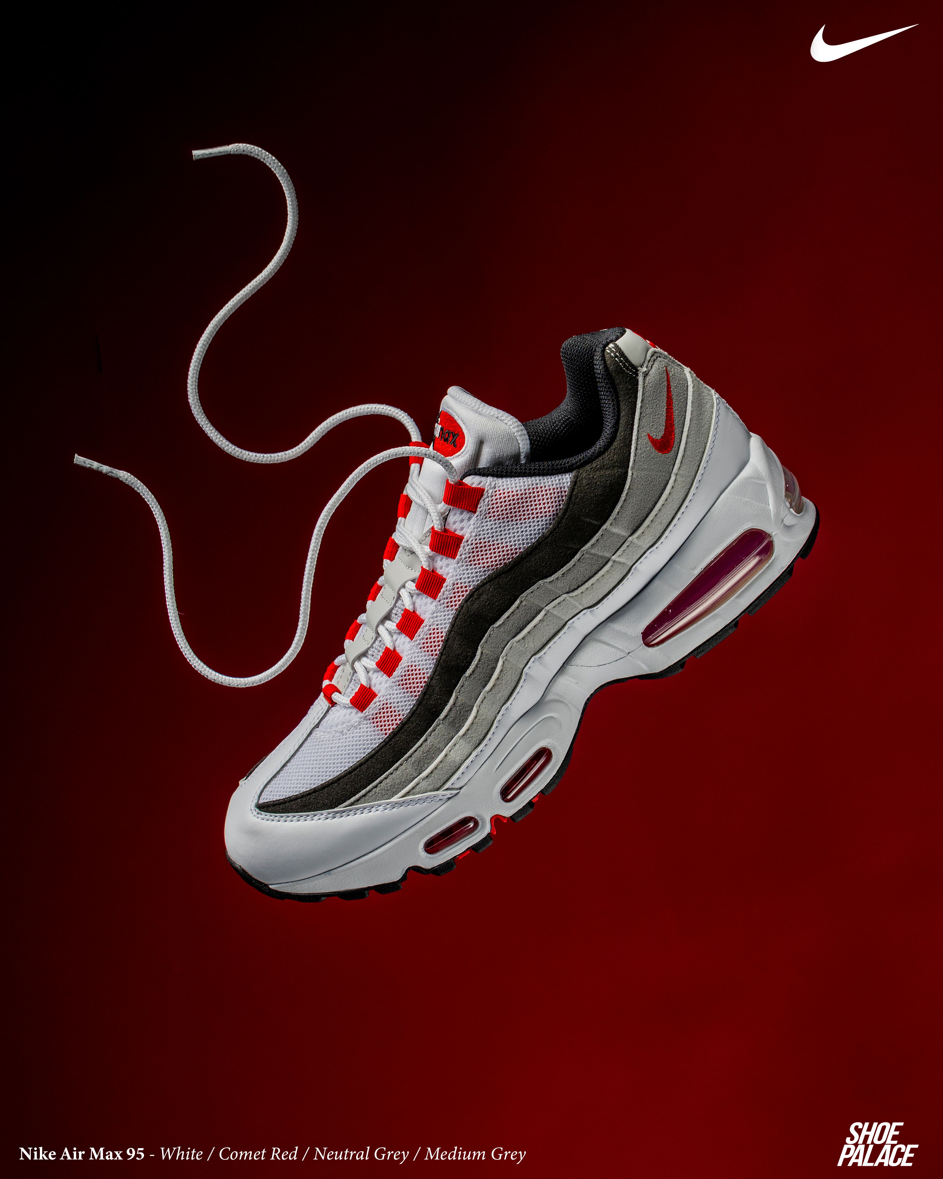 Nike Air Max 95 sneaker on a red background, featuring white and black design.