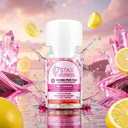 A bottle of 7STAX product with lemon and pink crystals in the background.