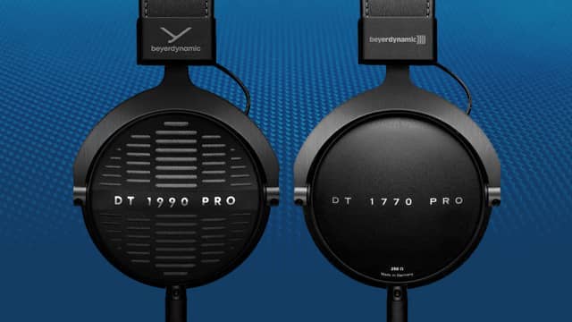 Two pairs of headphones on a blue background. One pair are open back, the other are closed back.