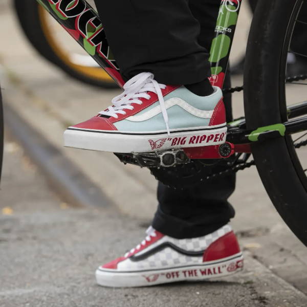big ripper red and blue vans on foot on bike