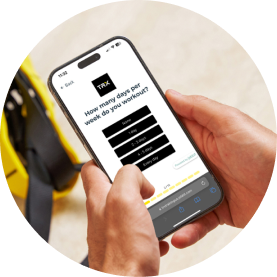 Person holding a smartphone displaying a questionnaire on a light background.
