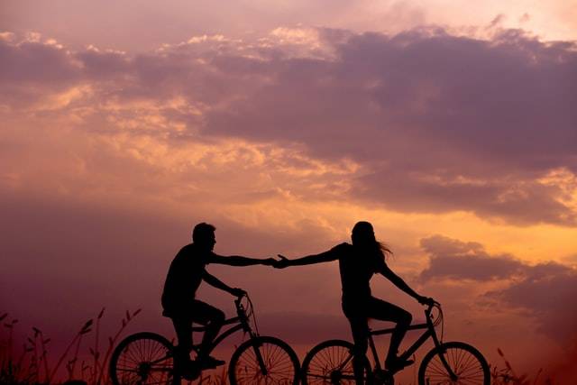 Couple Riding A Bike