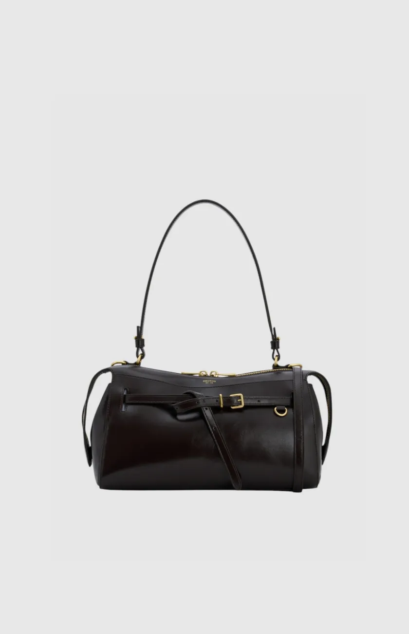 Black leather handbag with a shoulder strap and gold accents.