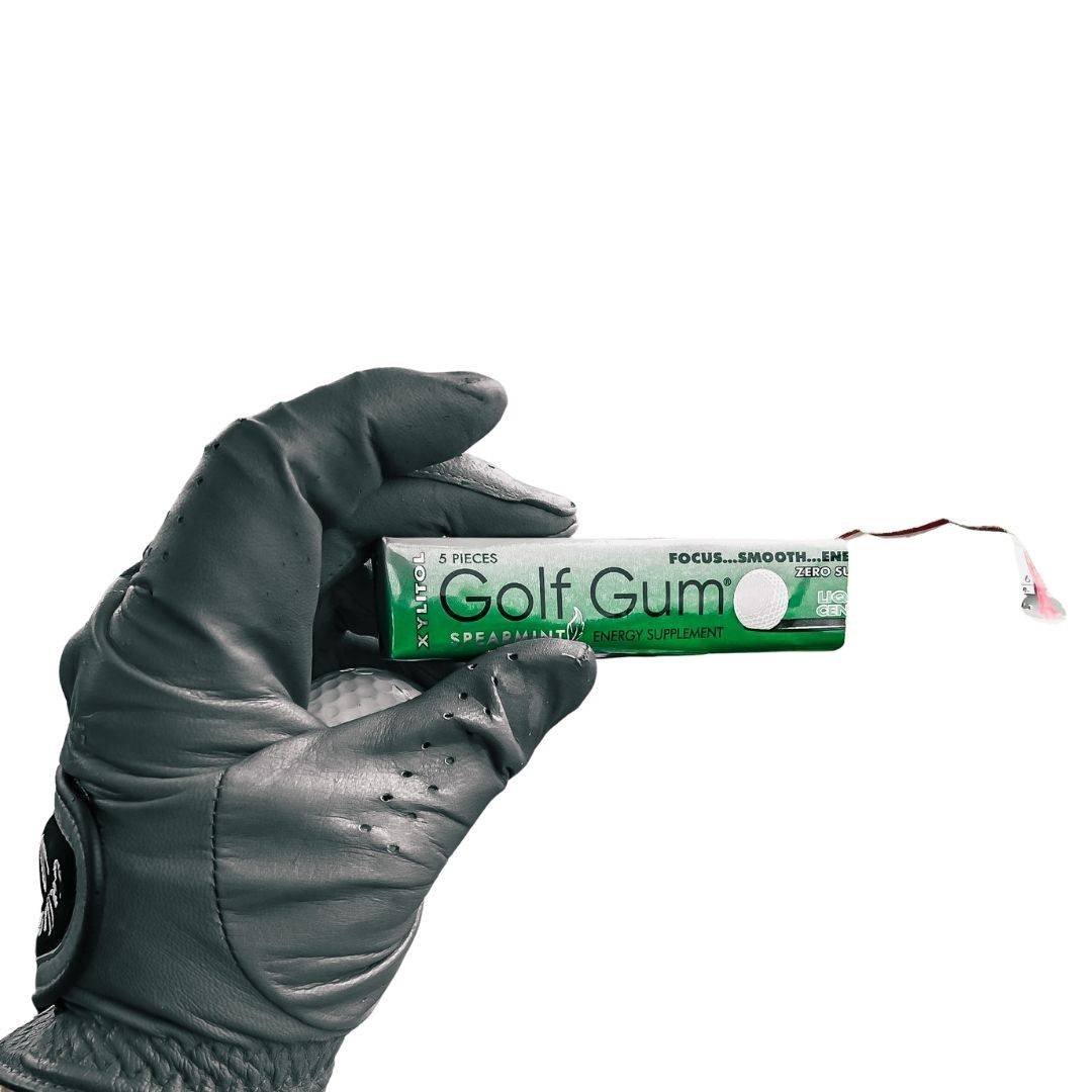 Hand holding a pack of Golf Gum