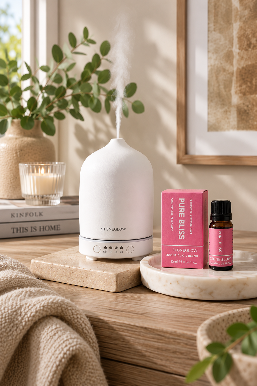 A white diffuser with essential oils on a wooden table, surrounded by plants.