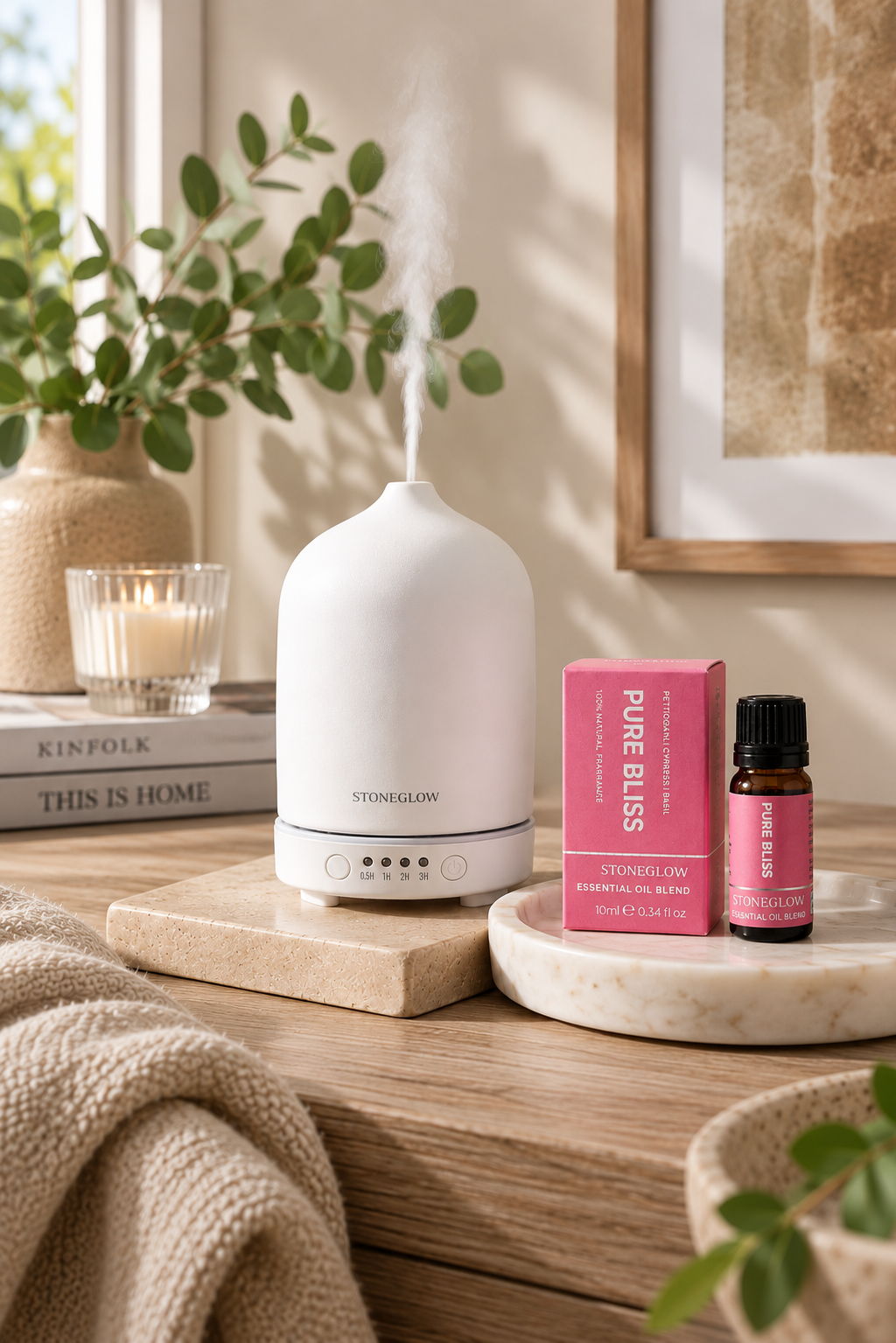 A white diffuser with essential oils on a wooden table, surrounded by plants.