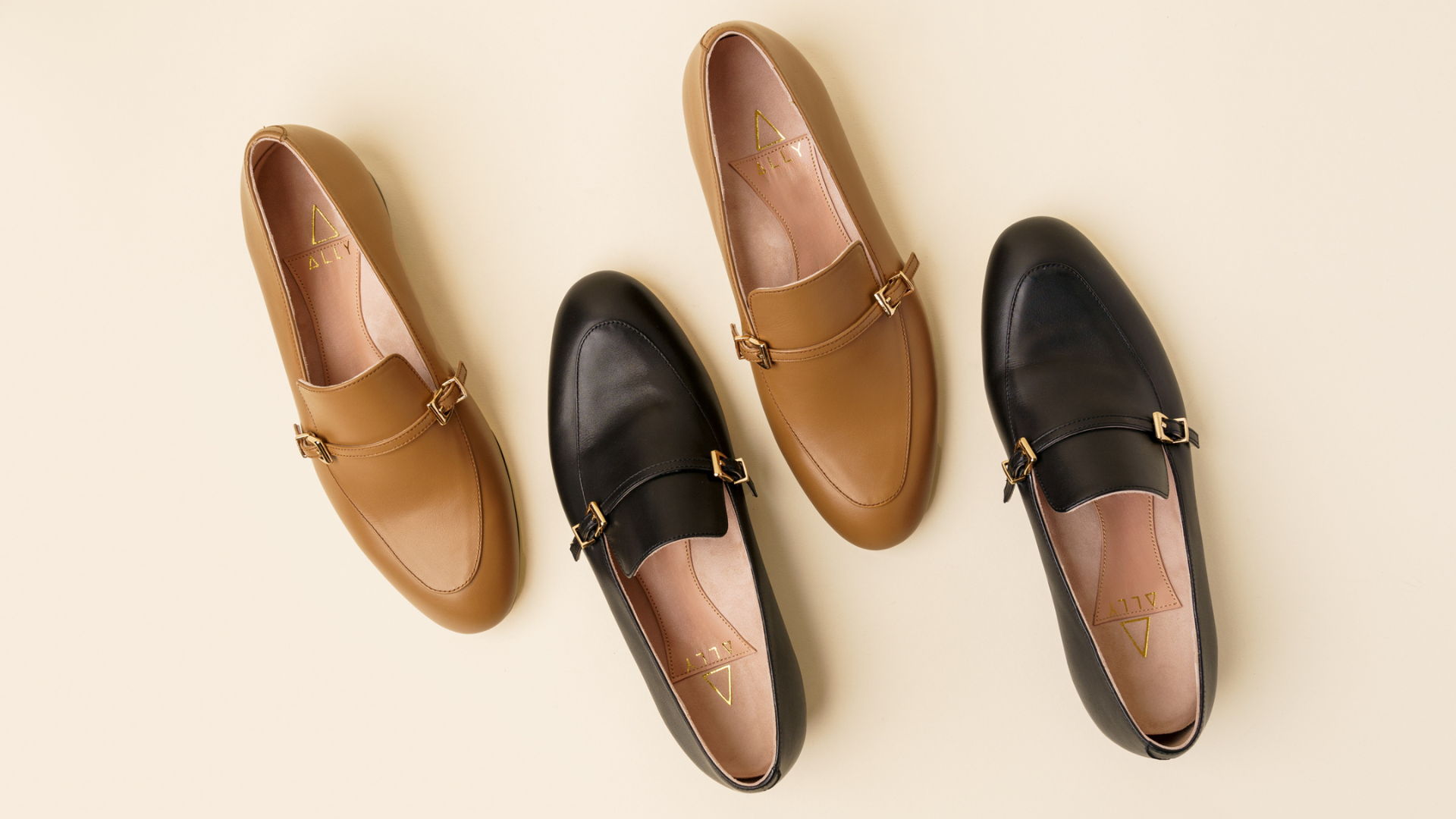 Four pairs of stylish loafers in various colors on a beige background.