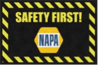 Safety first sign with NAPA logo and caution stripes.
