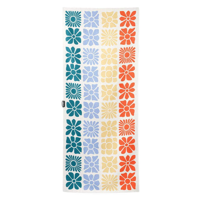 Colorful patterned fabric featuring floral designs in various shades.