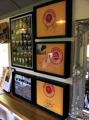 Pro Cyclist signed t-shirts on display in Shart Original T-Shirt Frames at Stan's Bike Shop in Australia