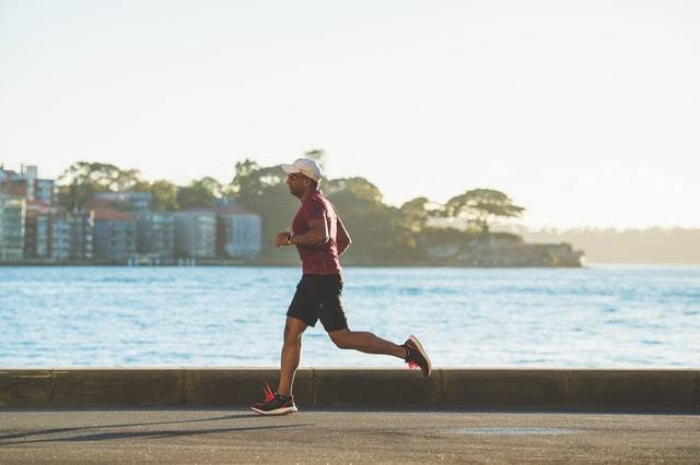 Man Running By Water