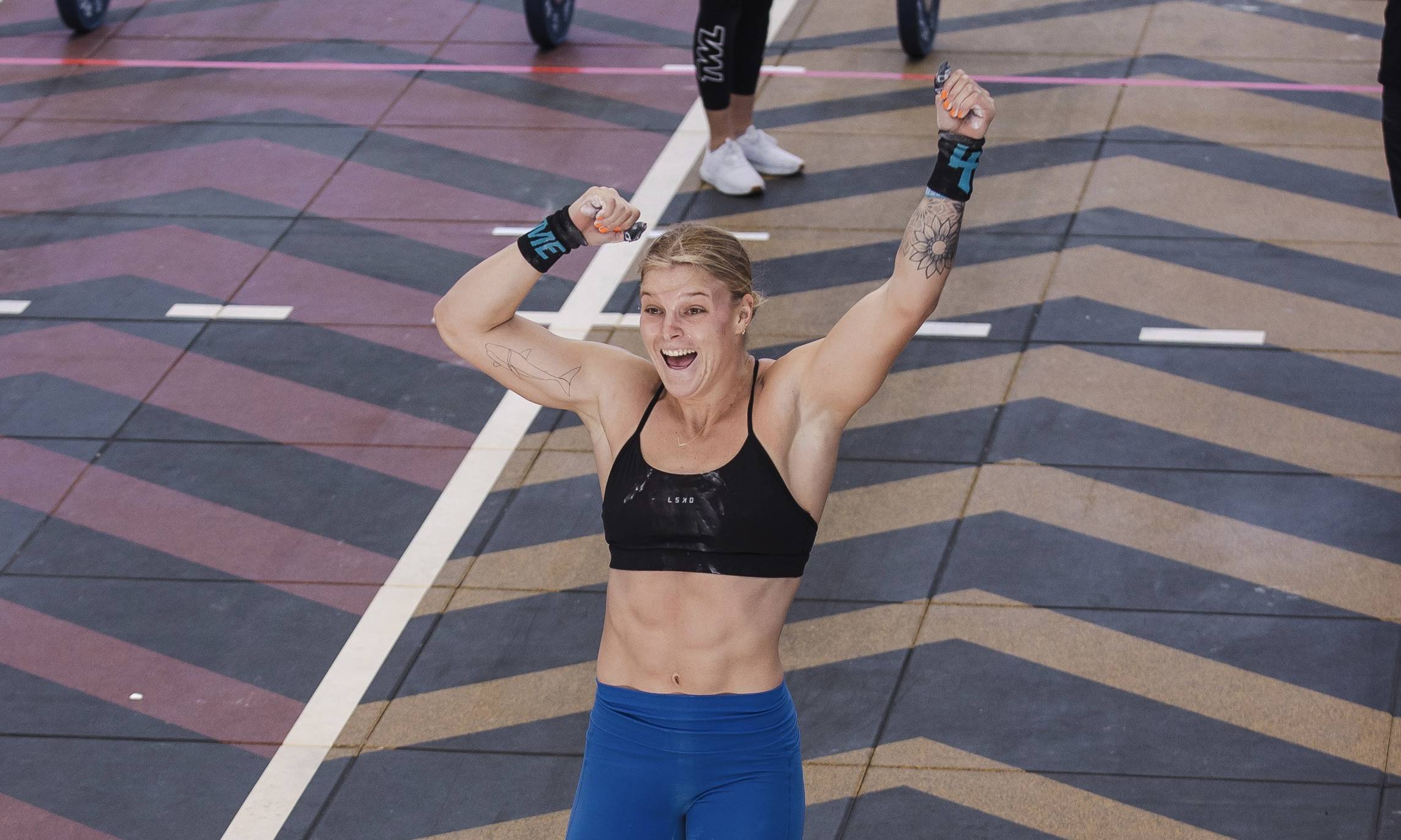 girl celebrating a crossfit test win