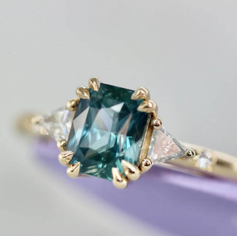 teal radiant cut sapphire and diamond 3 stone engagement ring