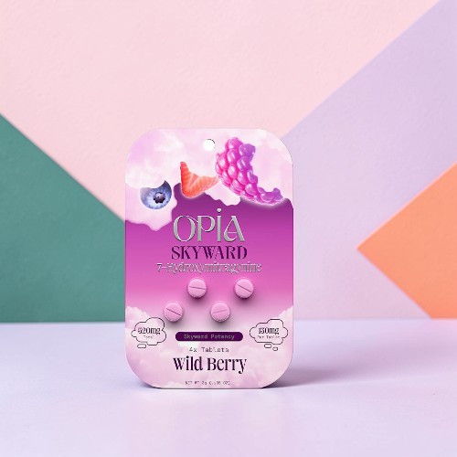 Packaging of Opia Sky Watch wild berry flavored gummies on a colorful background.