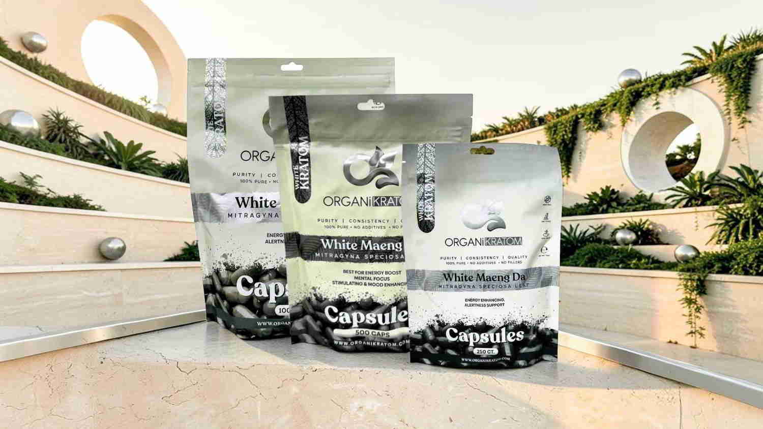 Three packages of a product displayed in a modern outdoor setting.