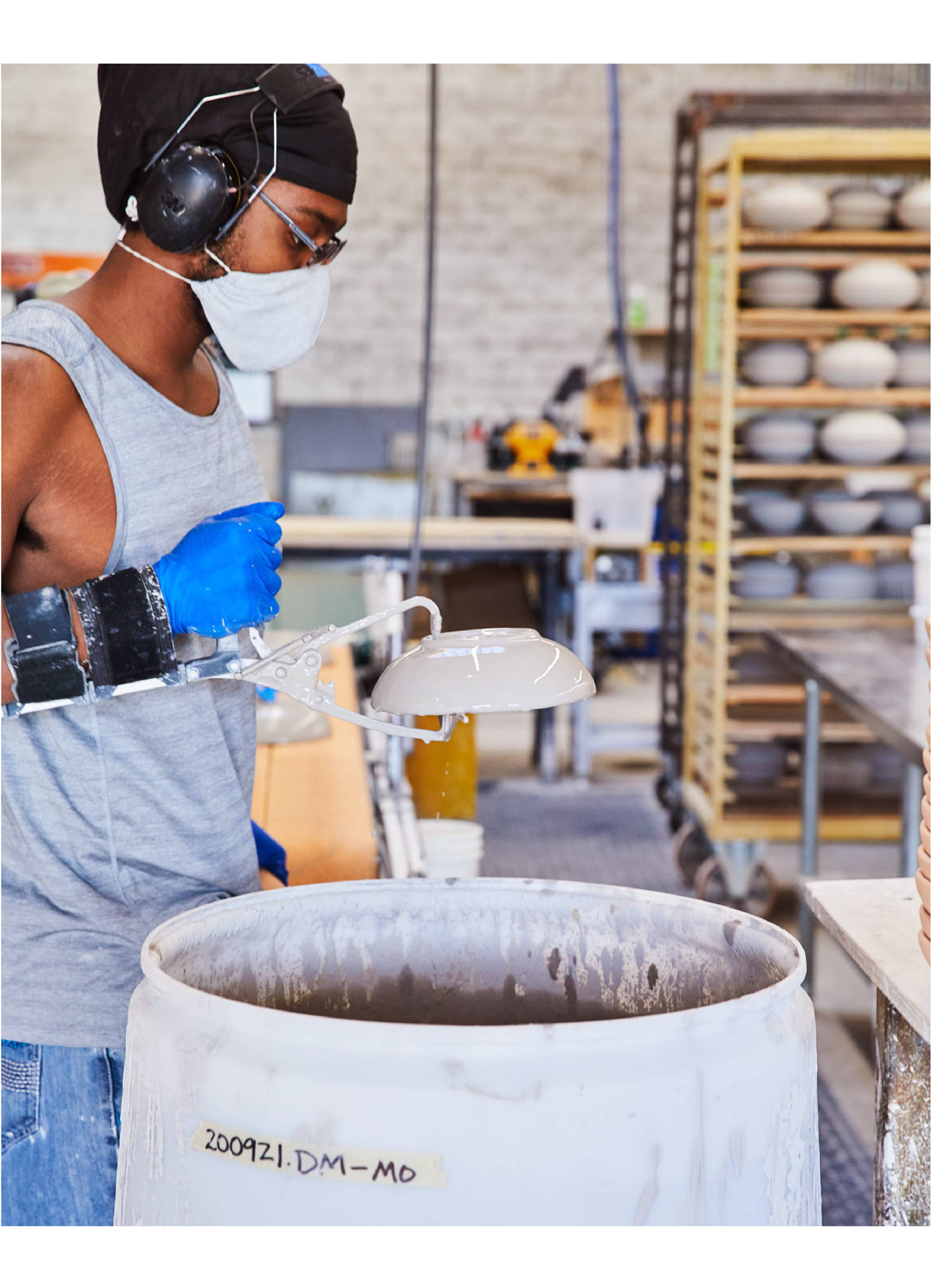 Everyday Bowl getting dipped in glaze at the East Fork factory