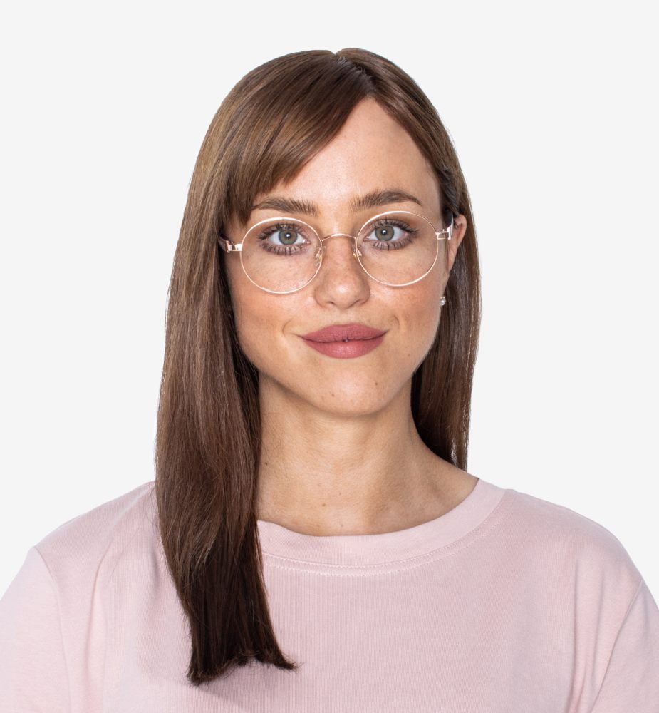 woman wearing oy Rose Gold , round eyeglasses for diamond face shapes, on a white background