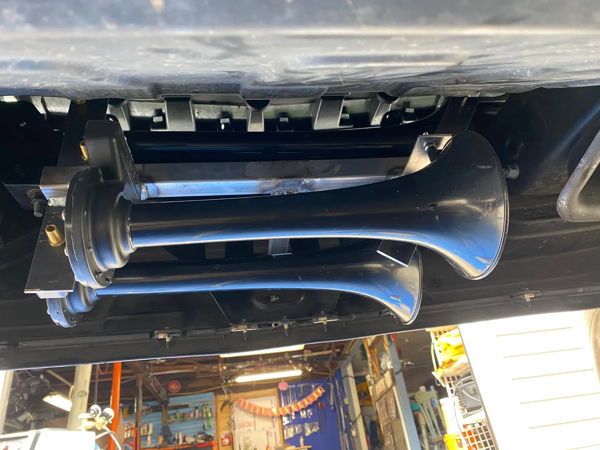 Two black train horn bells mounted under front bumper of Stephen's 2018 Chevy Silverado 1500 Conductor's Special 244K photo 5