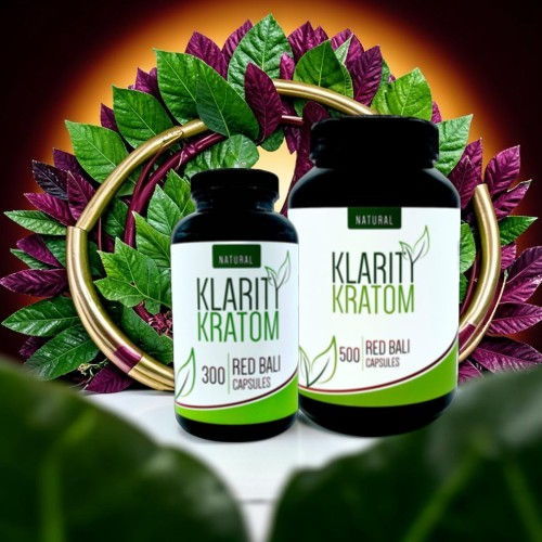 Bottles of Klarity Kratom supplements surrounded by decorative leaves.
