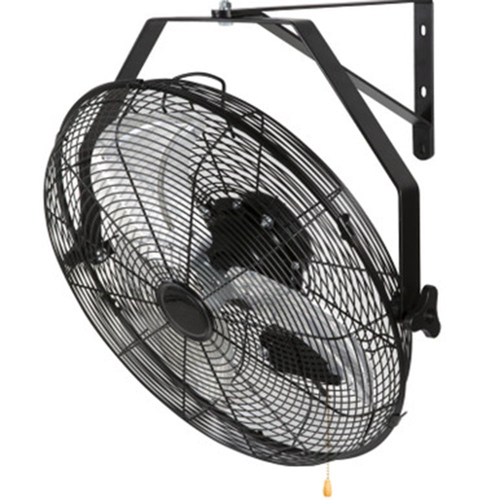 Wall-mounted industrial fan with metal blades and protective grille.