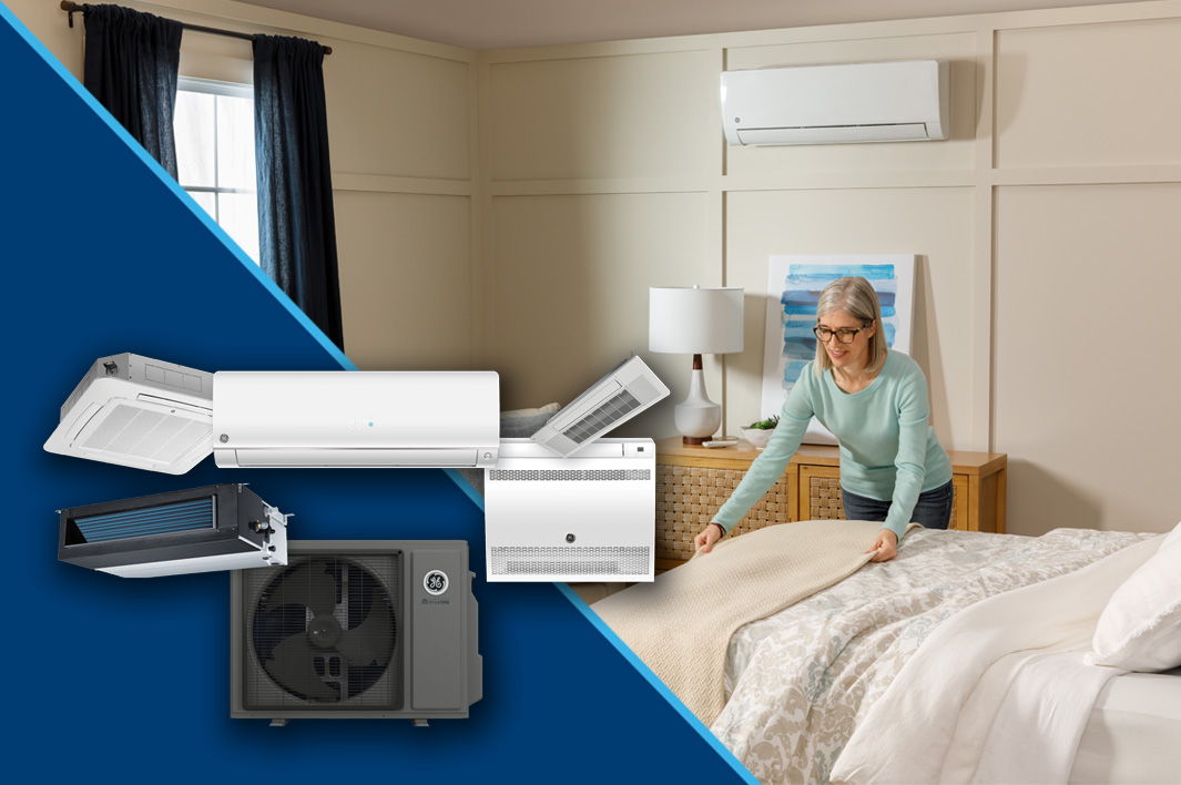 Woman adjusting bedding in a room with air conditioning units displayed.