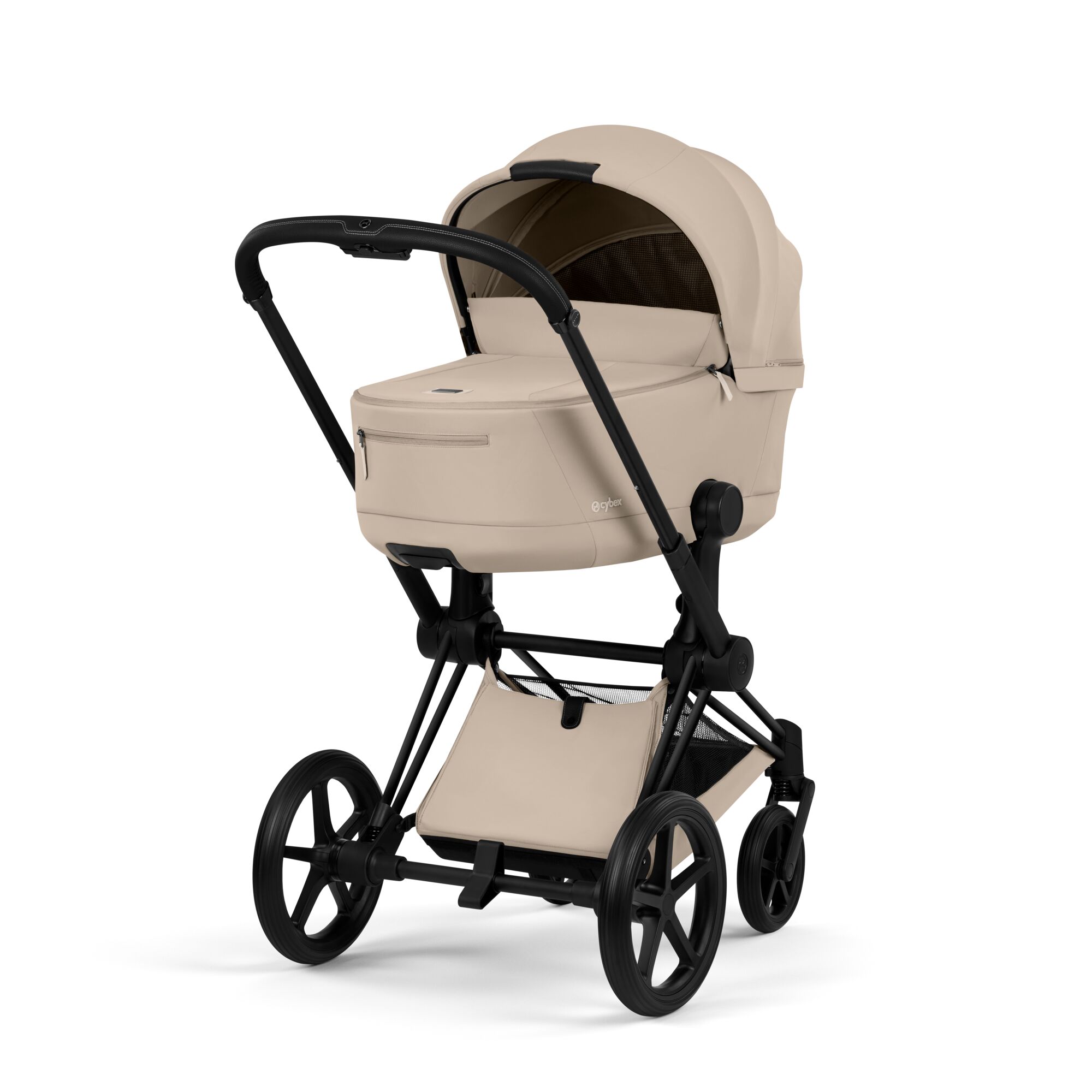 A beige baby stroller with a black frame and wheels.
