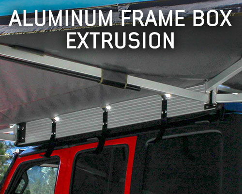 Aluminum frame box extrusion mounted on a vehicle roof with lights.