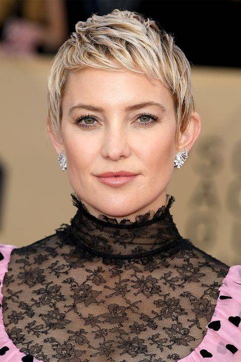 Woman with a blonde chopped pixie cut