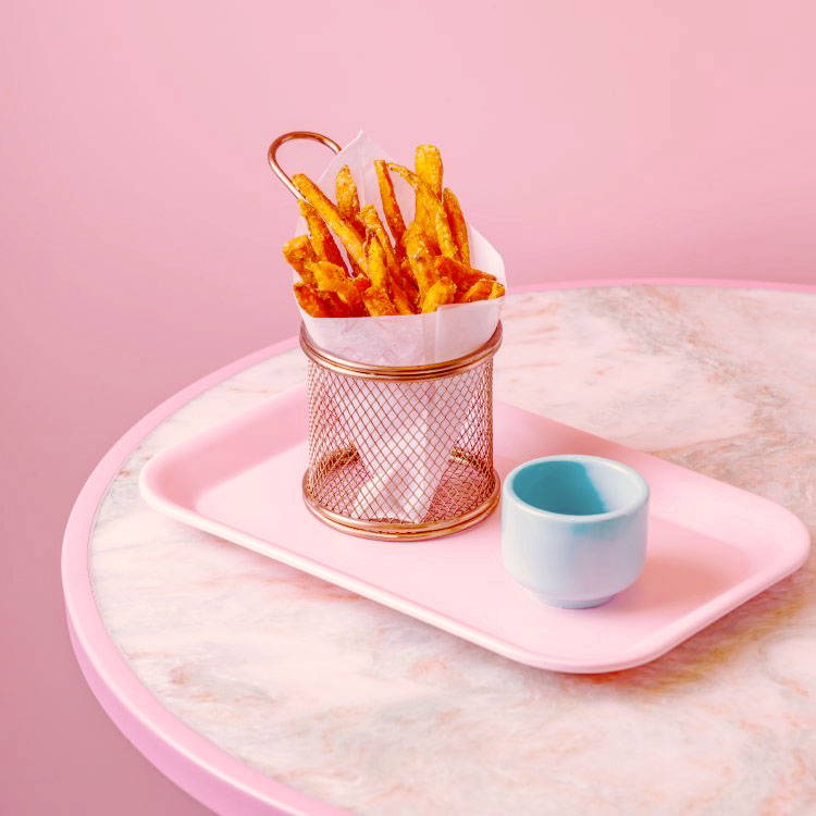 Sweet Potato Fries served with a pot of sauce