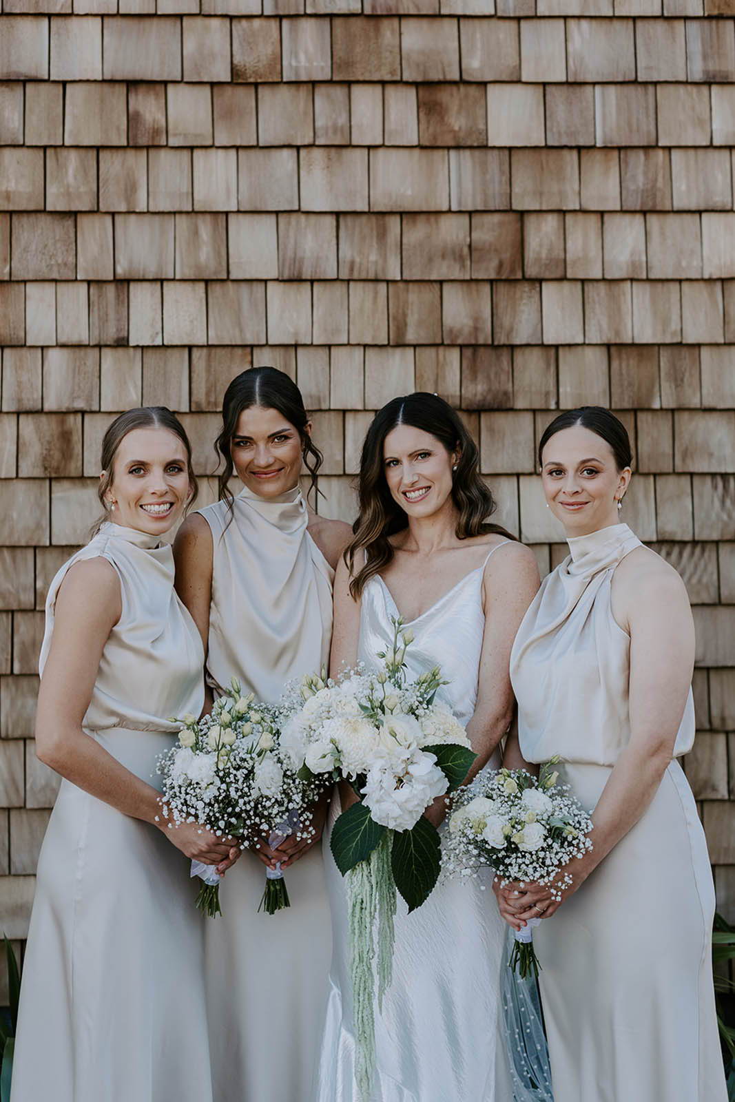 Bride, standing with her bridesmaids