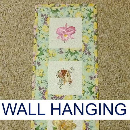 embroidered quilted wall hanging in spring colors, rectangular shape