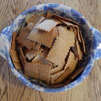 Overhead view of a bowl of homemade sourdough crackers