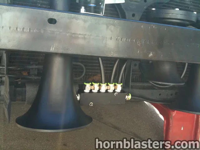 Rear three-quarter Frank's Nissan Maxima trunk decklid taillights sedan stance with train horn build context photo 3