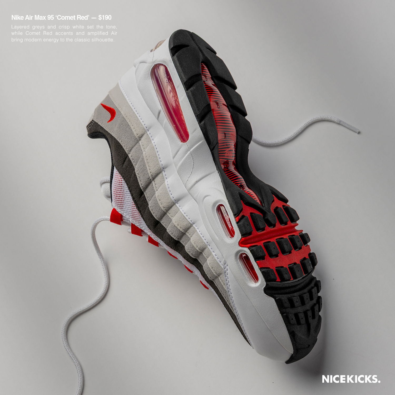A Nike sneaker with red and black accents on a gray background.