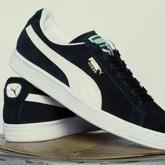 close up of puma suede sneakers black