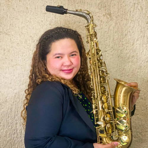 Joverey Manero holding P Mauriat alto saxophone