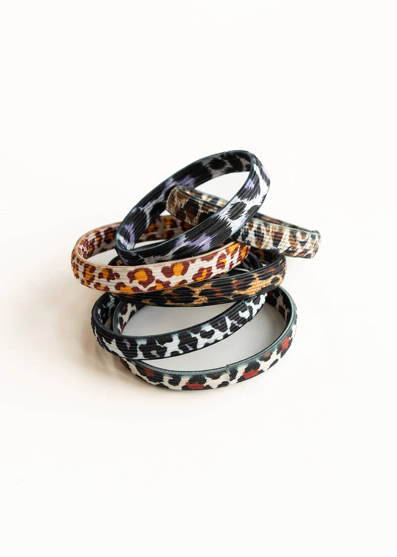 A set of 6 different coloured hair ties with animal print pattern