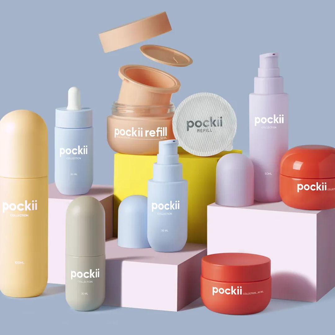 Various skincare products in colorful packaging against a light blue background.