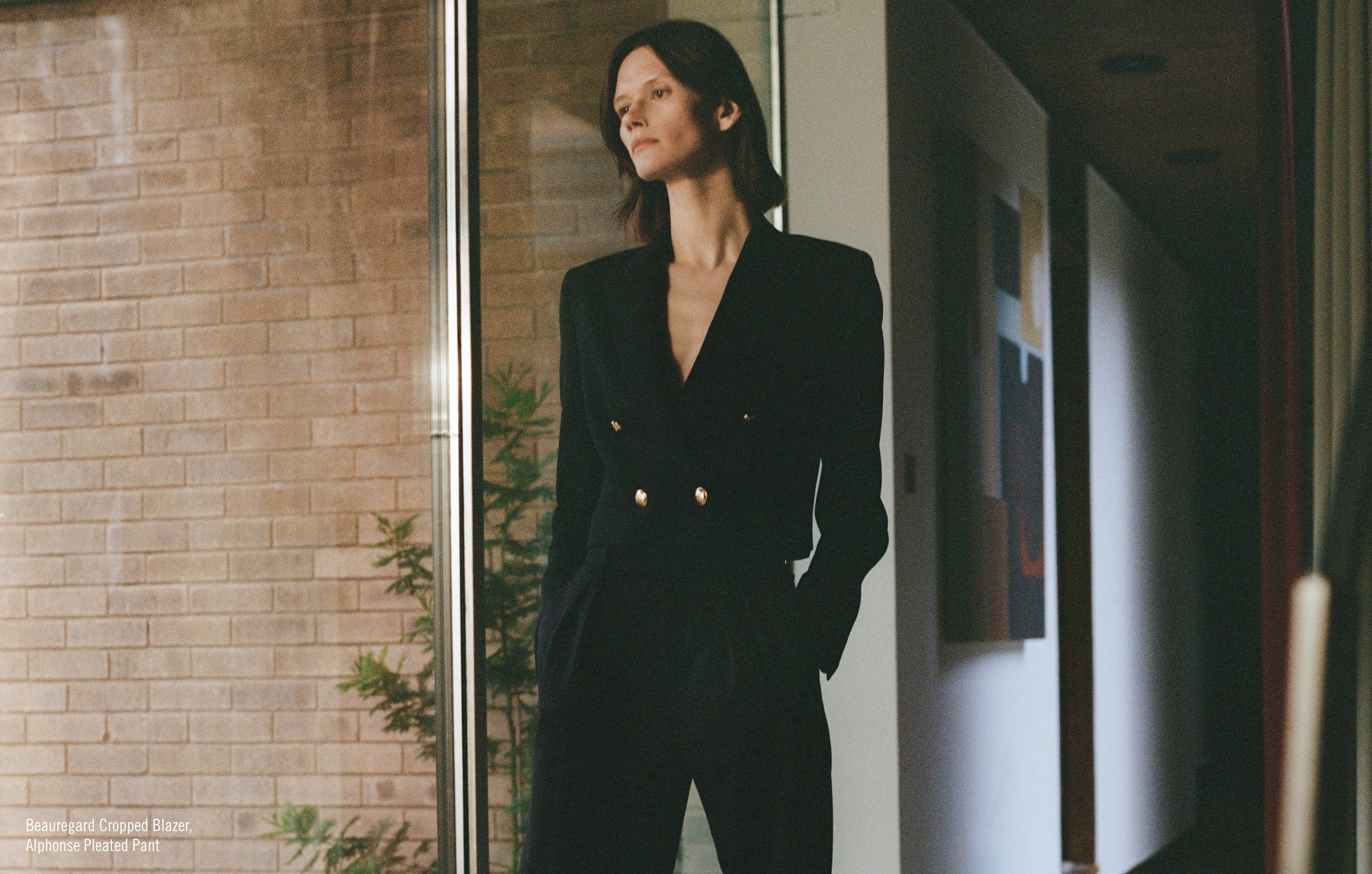 Image of model in black jacket and pants