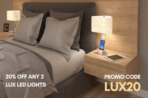 Brooklyn Aura - LED Light charging a smartphone and a tablet on a bedside table