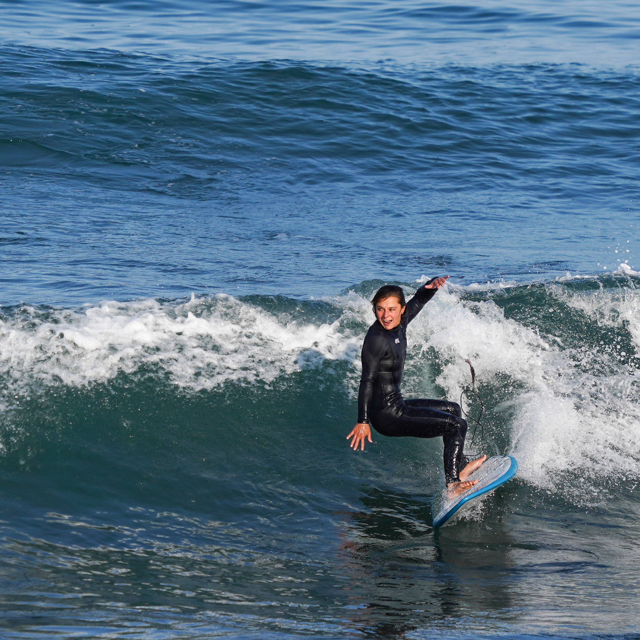 Marie surfing our performance Softtop Foamie Fish Board