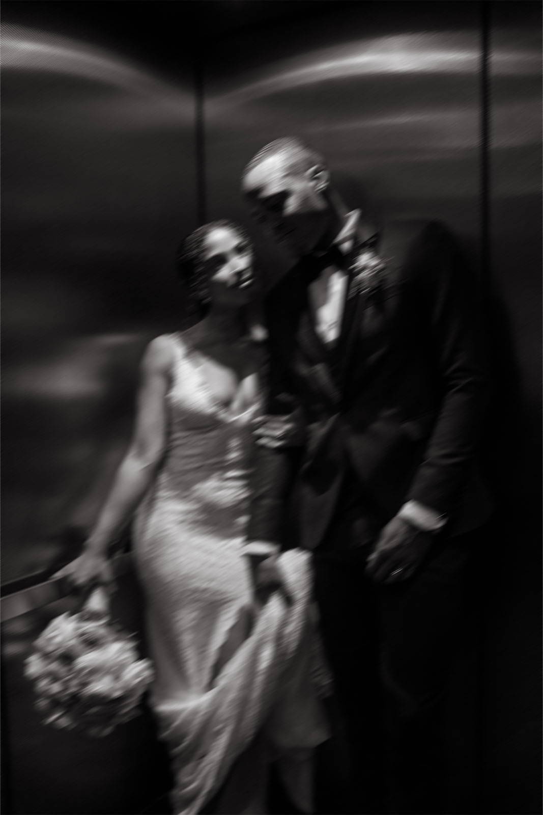 Bride and groom in elevator