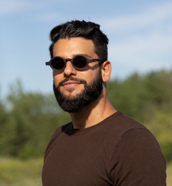 Man wearing Magnolia, Full wood small round sunglasses