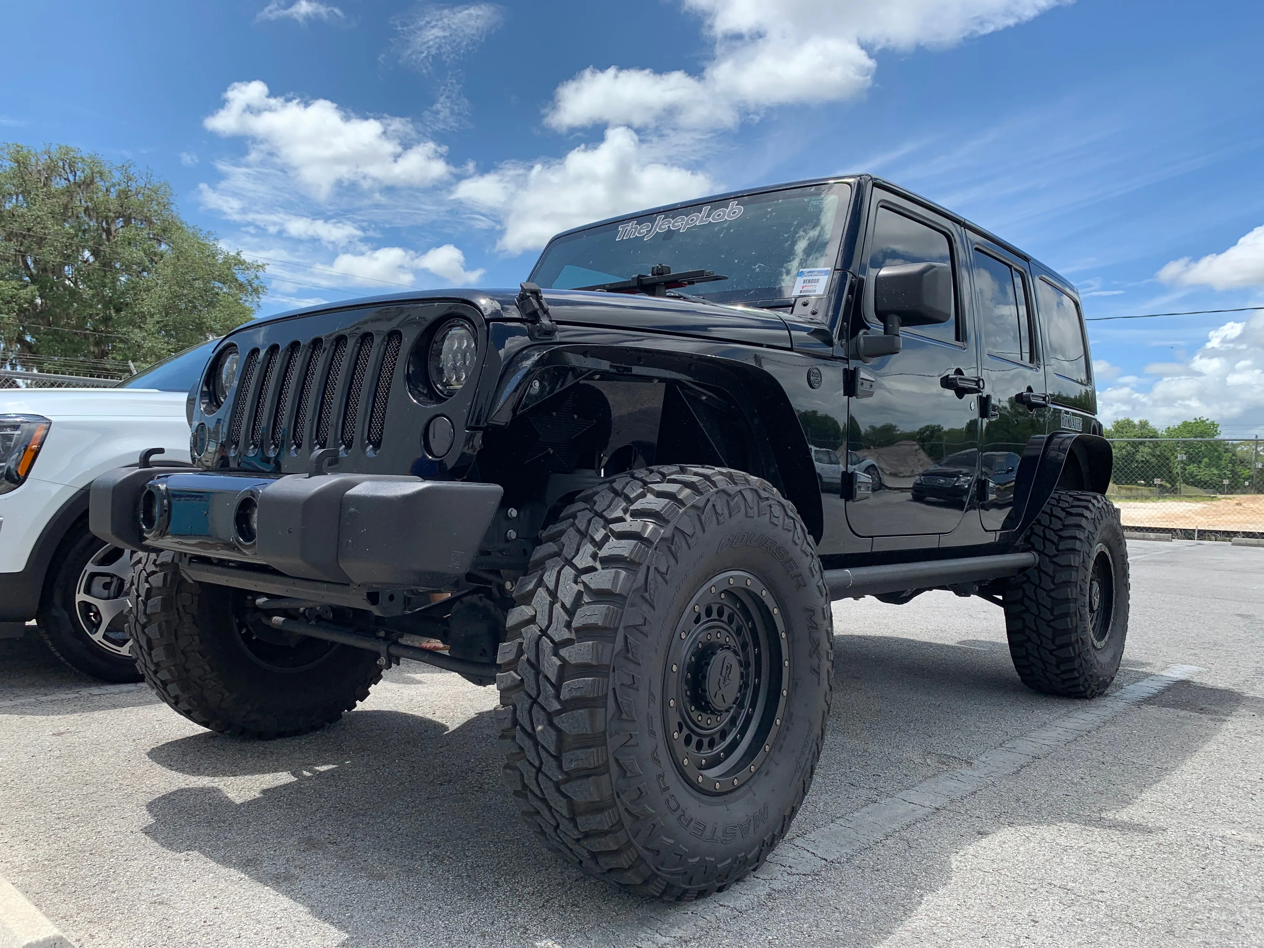Side profile Annie's 2017 Jeep Wrangler JKU wheels tires lift bumper exterior Wrango Horn Kit gallery photo 2